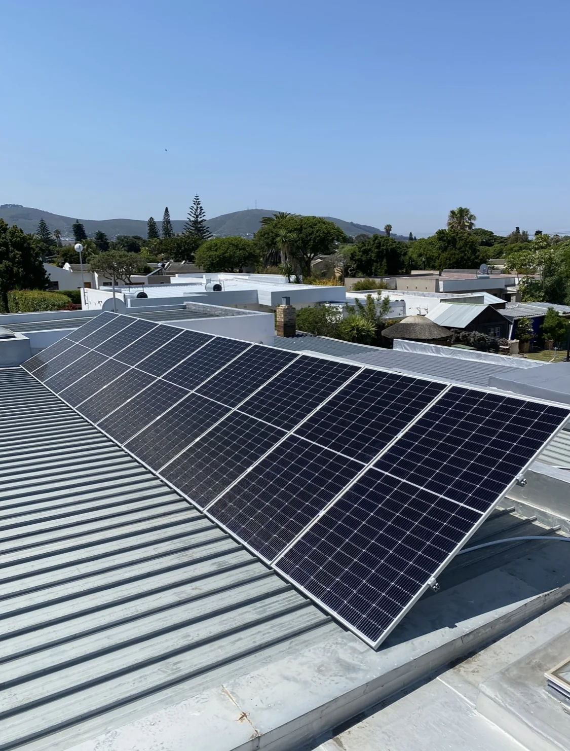 Solar panels installed on a corrugated roof