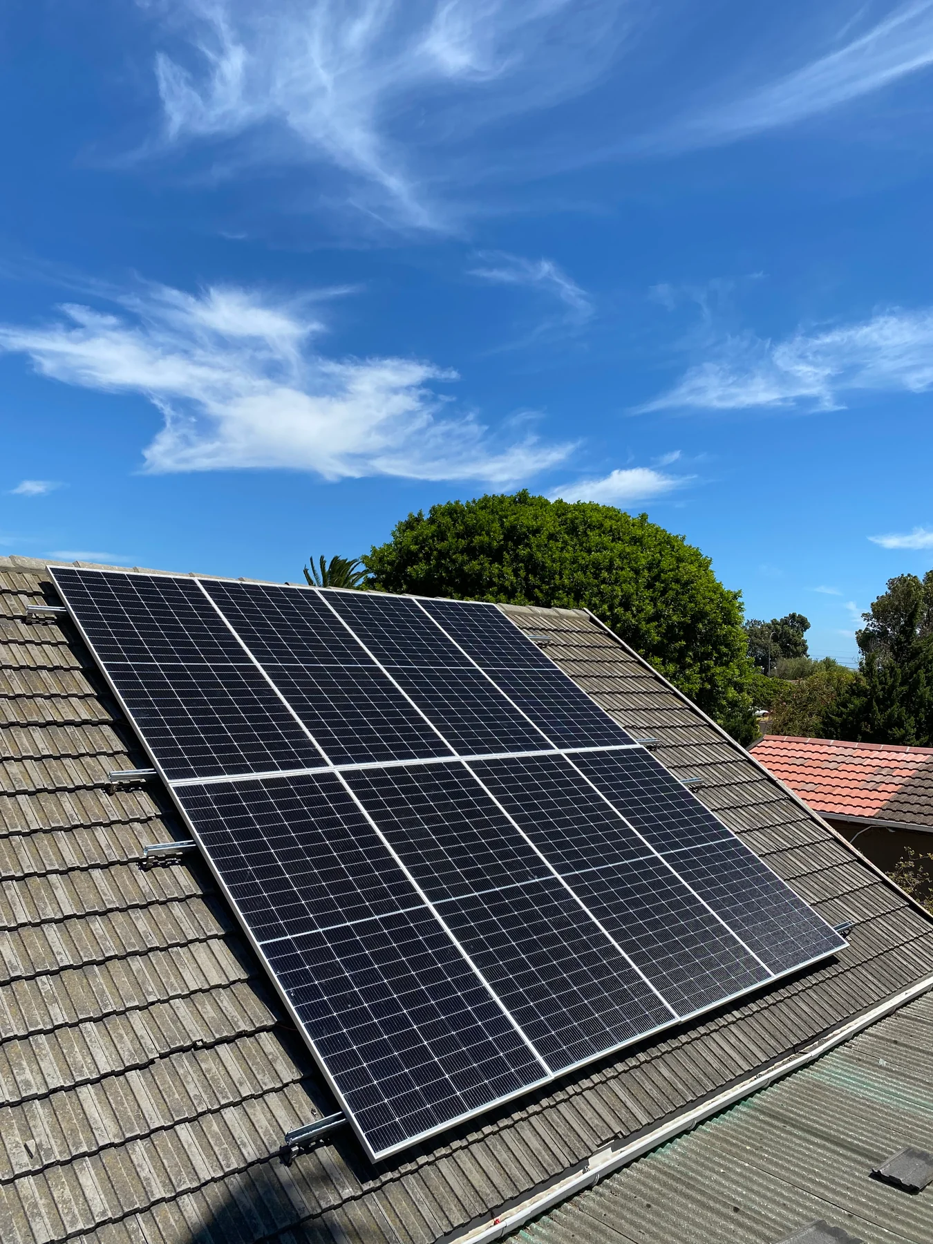 Solar panel installation beneath a clear sky