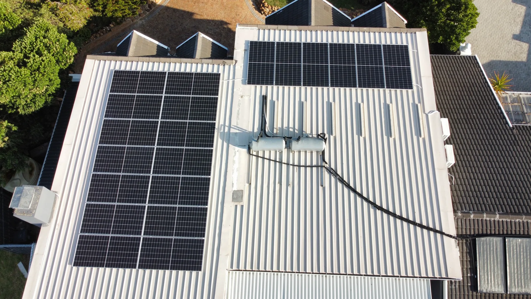 Aerial view of solar panels on two roof sections