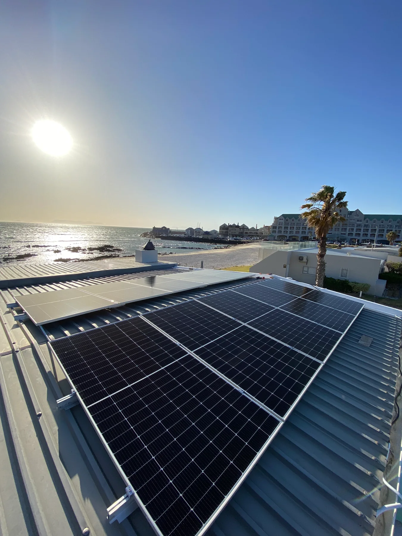 Rooftop solar array at sunset
